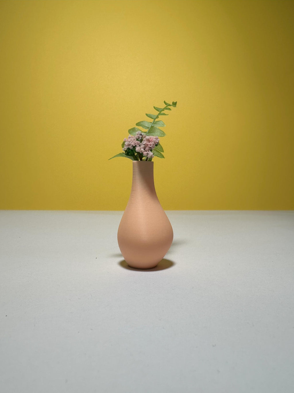 Modern miniature floor vase set viewed from a side angle